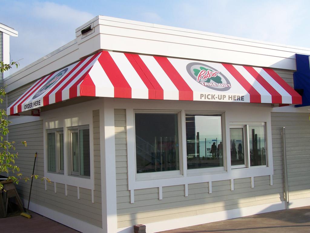 striped awnings outside of commercial building